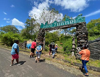 Group of people heading to the lava tunnels at Frontier Ranch.
